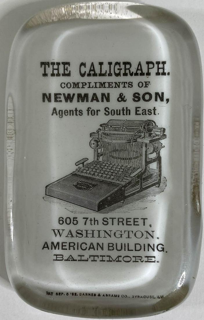 The Caligraph Typewriter, Newman & Son Paperweight: [Typewriter] The Caligraph Typewriter, Newman & Son, Agents for the South East, Baltimore, Maryland, Advertising Glass Paperweight by Barnes & Abrams Paperweight Co. Syracuse, New York. Measures .75 x