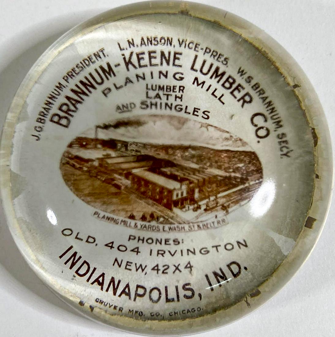 Brannum-Keene Lumber (Indianapolis) Paperweight: Brannum-Keene Lumber (Indianapolis, Indiana). Antique Glass Advertising Paperweight. Measures 1.125 x 3 inches. Very good to excellent condition. If lot is absent of a condition report one may be requ