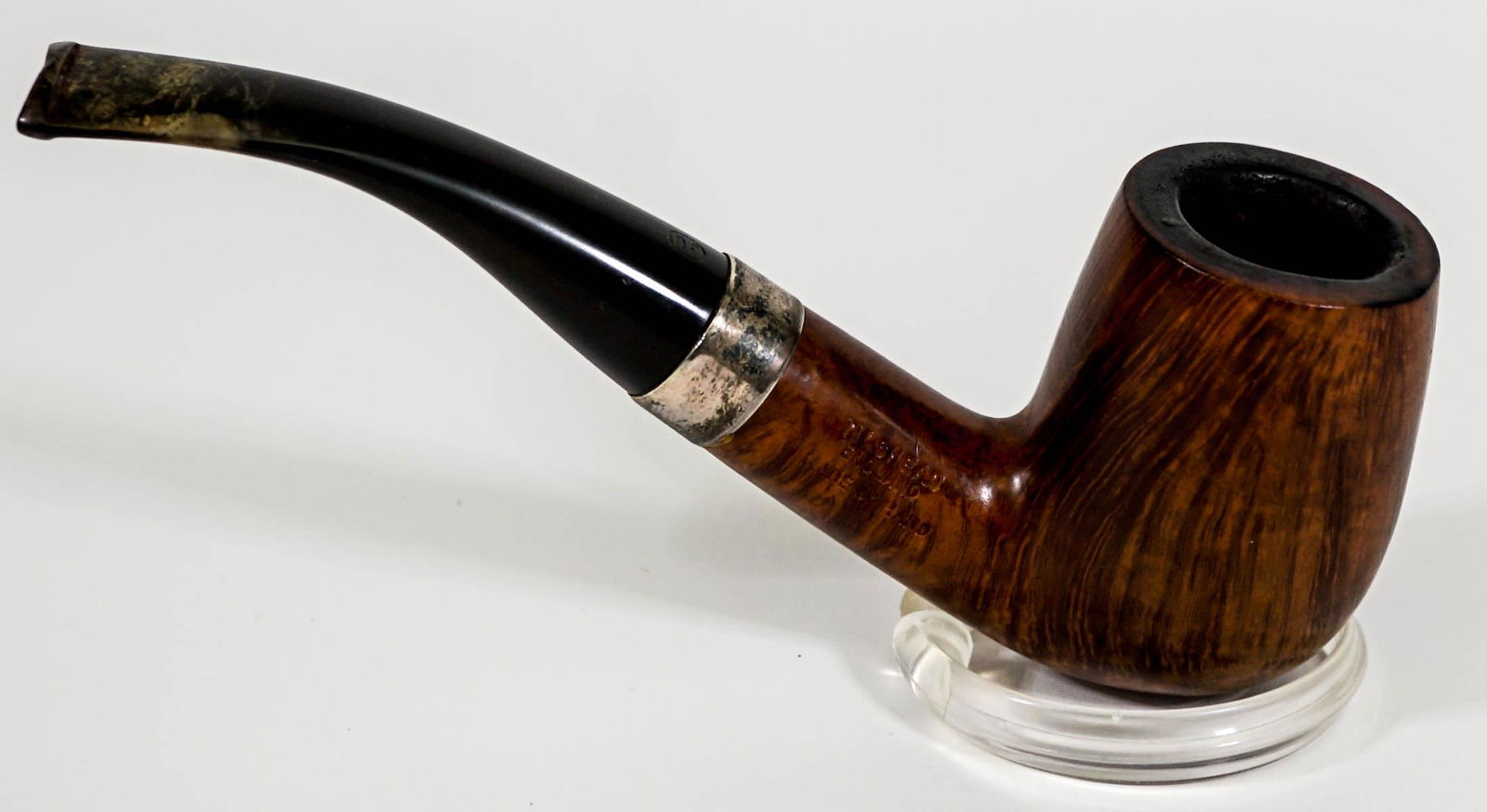 James Upshall Pipe [Sterling Band]: James Upshall pipe with sterling .925 band. Bowl measures 1.5 in. x 1.5 in. x 2.5 in. high and 7 in. long. Condition used. No evidence of damage or repair. If lot is absent of a condition report one m