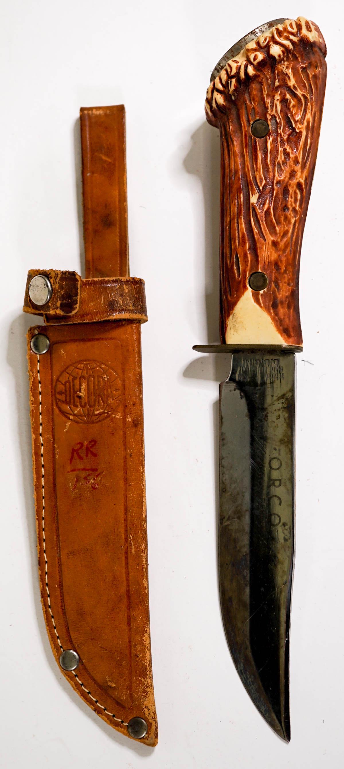 Decora Sheath Knife D. B. G. M.: Decora fixed knife with 4.5 in. blade and leather sheath. Measures 9 in. long. No evidence of damage or repair. If lot is absent of a condition report one may be requested via email. Condition report 