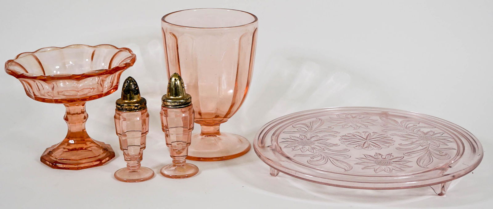 Vintage (5) Glass Serveware: Five (5) vintage glassware pieces. Includes: 5 in. and 6.25 in. compote dishes, 10 inch footed plate (note scratch underside of plate at edge), and 4.75 inch tall salt and pepper shaker set. No eviden