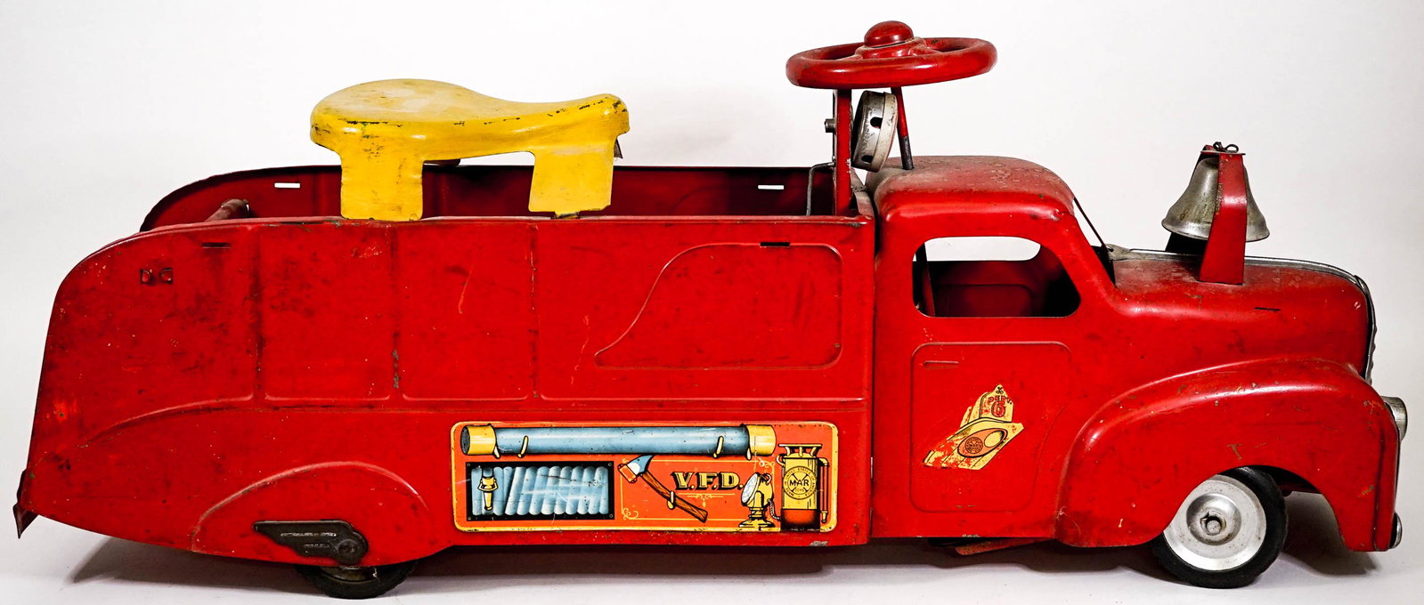 Vintage MARX Child Ride On VFD Firetruck: Vintage MARX child ride on VFD Firetruck. Circa 1940's. Pressed steel. Wear to paint, bell rings, the siren doesn't work and needs adjustment or repair. Measures approximately 30 in. long x 7 in. wide