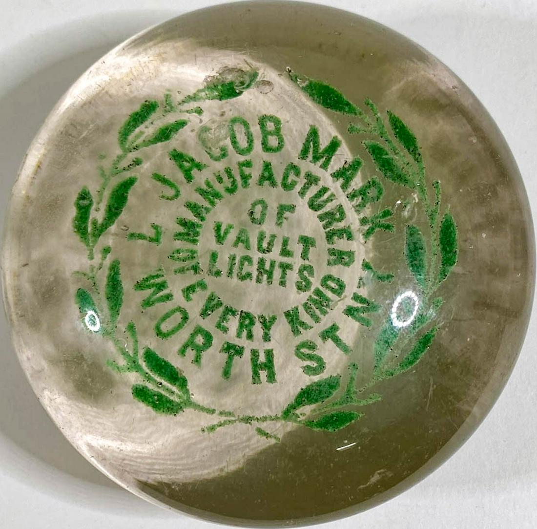 [New York, New York] Jacob Mark Vault Lights: [New York, New York] Jacob Mark Vault Lights Antique Glass Advertising Paperweight (green letters). Measures 1.75 x 3.25 inches. Good condition with chips, surface scuffing and light scratches on edge