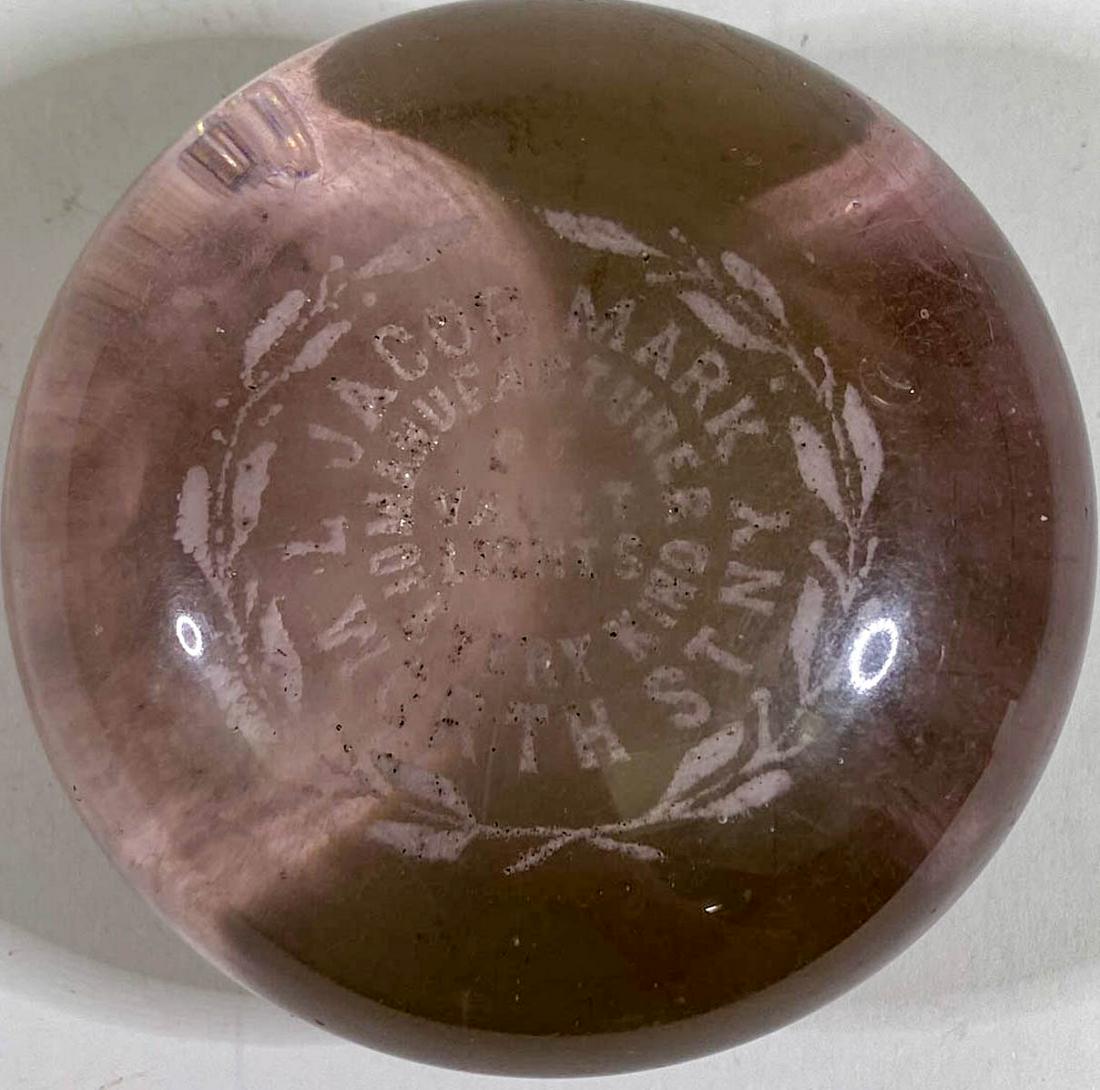 [New York, New York] Jacob Mark Vault Lights: [New York, New York] Jacob Mark Vault Lights Antique Glass Advertising Paperweight (white letters). Measures 1.75 x 3.25 inches. Good condition with surface scuffing and light scratches on edges of ba