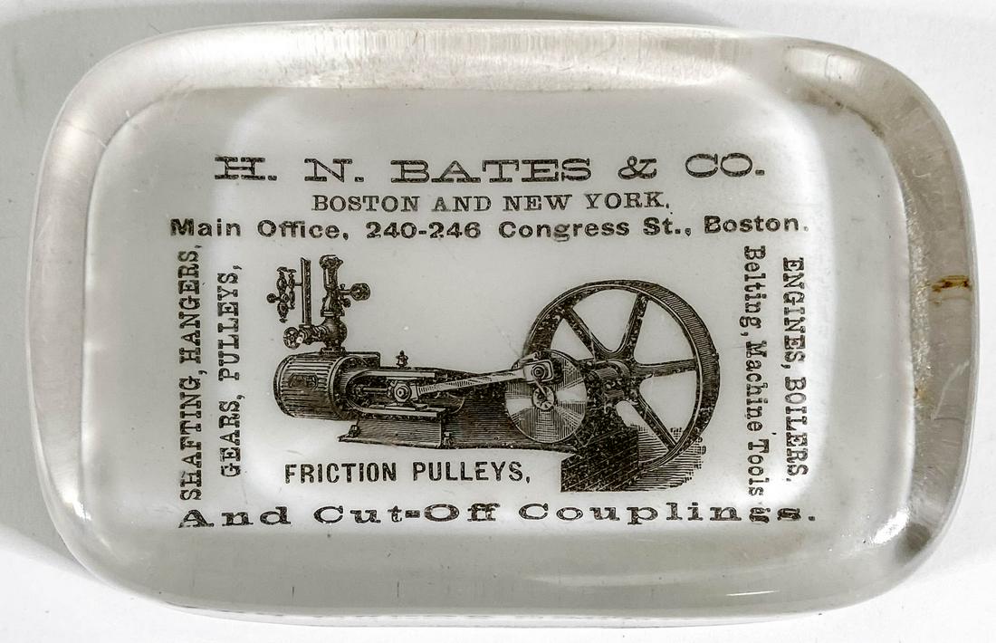 [Pulleys] H.N. Bates (Boston & New York): [Pulleys] H.N. Bates (Boston & New York) Antique Glass Advertising Paperweight by Barnes & Abrams, Syracuse, New York. Measures .875 x 4 x 2.625 inches. Good condition, one chip on edge of base. Prove