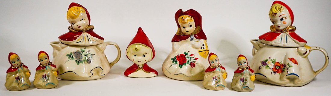 Vintage Little Red Riding Hood Table Wear: Vintage Little Red Riding Hood table serveware includes: (2) 8 inch creamers, 7.5 in. pitcher, 5 in. vase and 2 sets of salt and pepper shakers.Crazed, paint loss and rim wear with light chipping. The