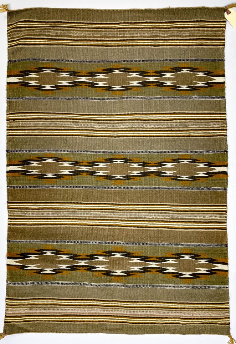 Navajo Wide Ruins Weaving/Rug 31.5 x 47: Navajo Wide Ruins weaving/rug (Adella B. Lee, weaver, appraised May 13, 1970 by Packard's Chaparral Trading Co., Santa Fe, New Mexico) measures 31.5 in. x 47 in. and is of earthtone colors of browns, 