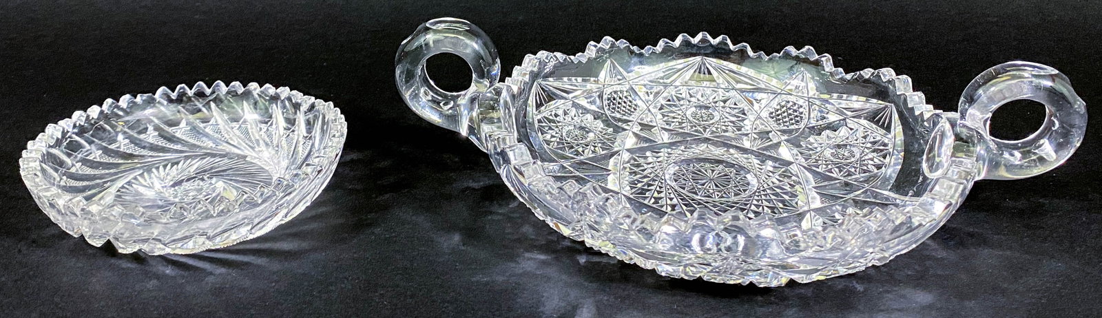 Antique ABP (2) Cut Glass Sawtooth Edge Dishes: Two (2) American Brilliant Period cut glass sawtooth edge dishes. The smaller measures 5 in. across rim x 1.25 in. tall (note 18 or more chips at the teeth of rim, see photos); and the larger double h