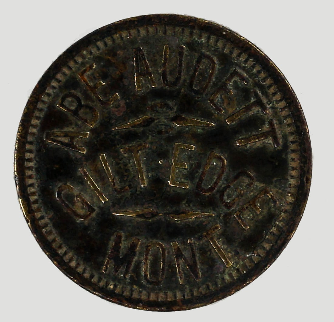 Abe Audett Token (Fergus County): Abe Audett Token (Fergus County, Giltedge, Montana) Measures 24 mm. Provenance: Montana private collection. If lot is absent of a condition report one may be requested via email. Condition report is p