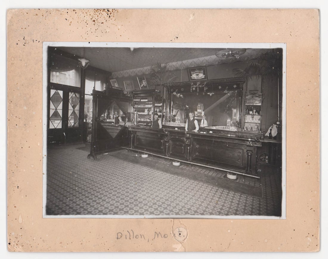 Dillon, Montana Antique Saloon Mounted Photo: Dillon, Montana Antique Saloon Mounted Photo. An antique mounted photo, image measures 5.5 x 4 inches, total size is 7 x 9 inches. Dillon, MT written in pencil lower center of mount. Provenance: Monta