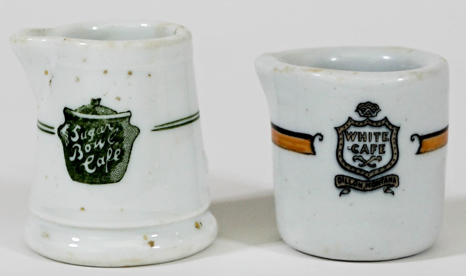 Montana Restaurantware Individual Creamers (2): Montana Restaurantware Individual Creamers (2). The White Cafe, Dillon, Montana (no damage), and Sugar Bowl Cafe (hairline crack). Provenance: Montana private collection. If lot is absent of a conditi