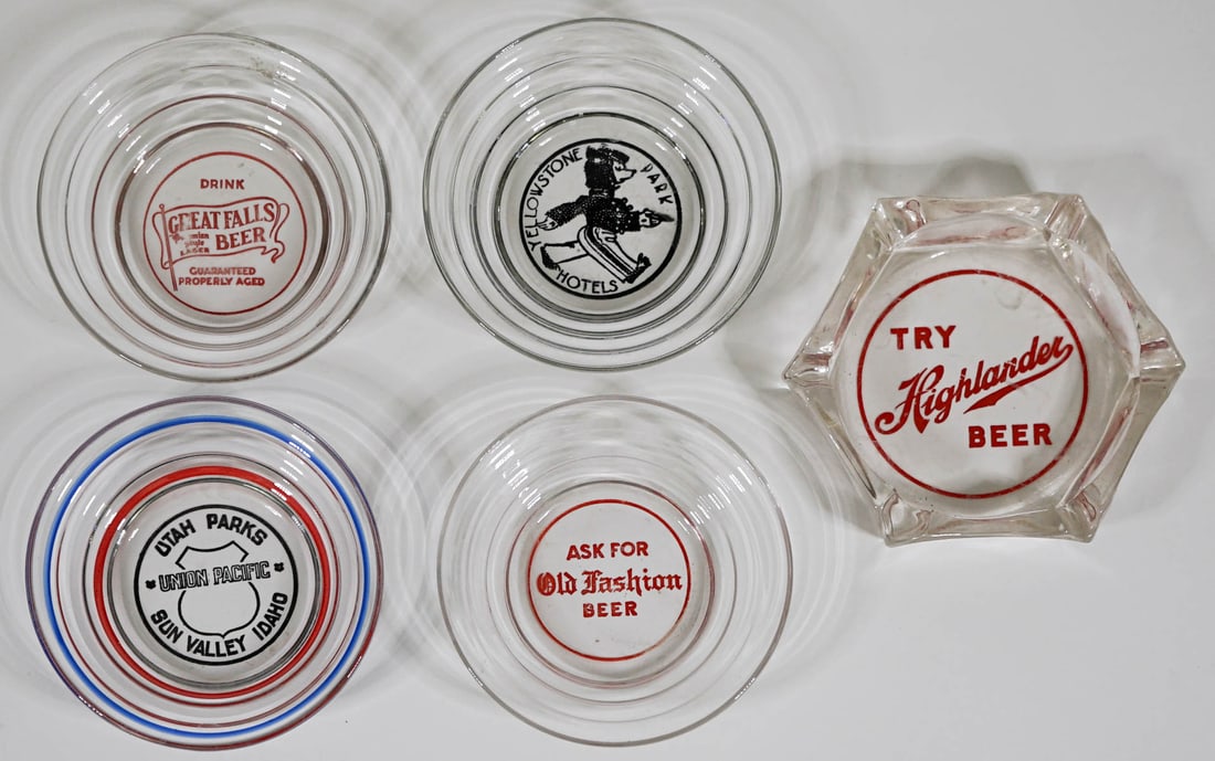 Vintage (5) Advertising Ashtrays [Idaho, Montana]: Five (5) vintage glass advertising ashtrays. Provenance: Montana private collection. If lot is absent of a condition report one may be requested via email. Condition report is provided as an opinion o
