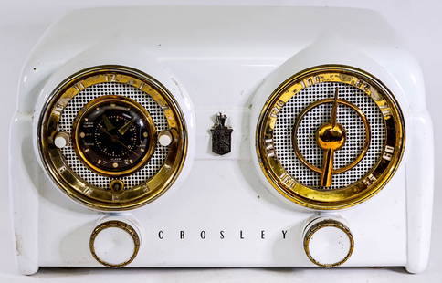 Vintage Crosley Clock Radio D25WE: 1950's Crosley white dashboard clock radio measures 13 in. x 6.25 in. x 7 in. high. Lacking knob on clock. Untested. Provenance: Montana private collection. If lot is absent of a condition report one