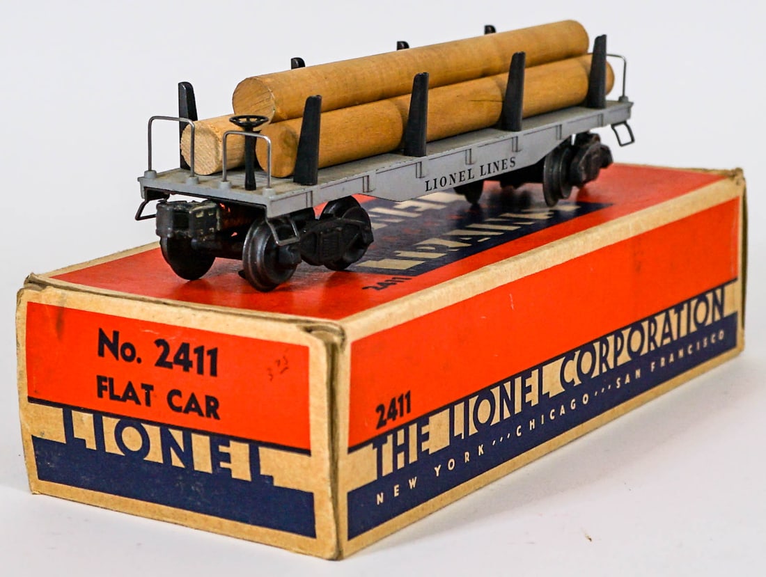Lionel No. 2411 Flat Car Mint in Box: Lionel No. 2411 Flat Car Mint in Box. Provenance: Missoula, Montana Private Collection. Untested, from a lifelong collector who serviced and repaired trains requiring any attention. If lot is absent o