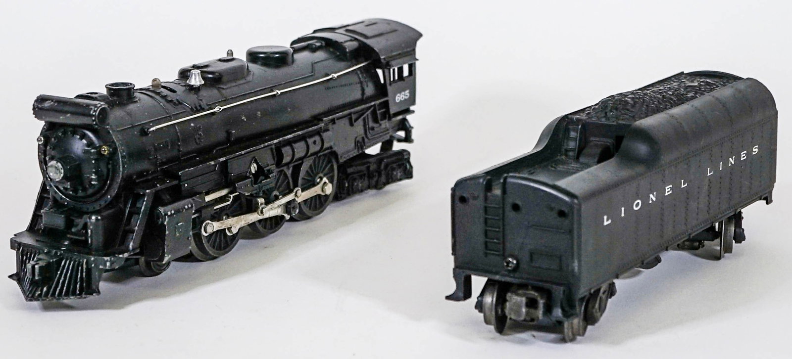 Lionel No. 665 Engine & 2046W Tender: Lionel No. 665 Engine & 2046W Tender. Provenance: Missoula, Montana Private Collection. Untested, from a lifelong collector who serviced and repaired trains requiring any attention. If lot is absent o