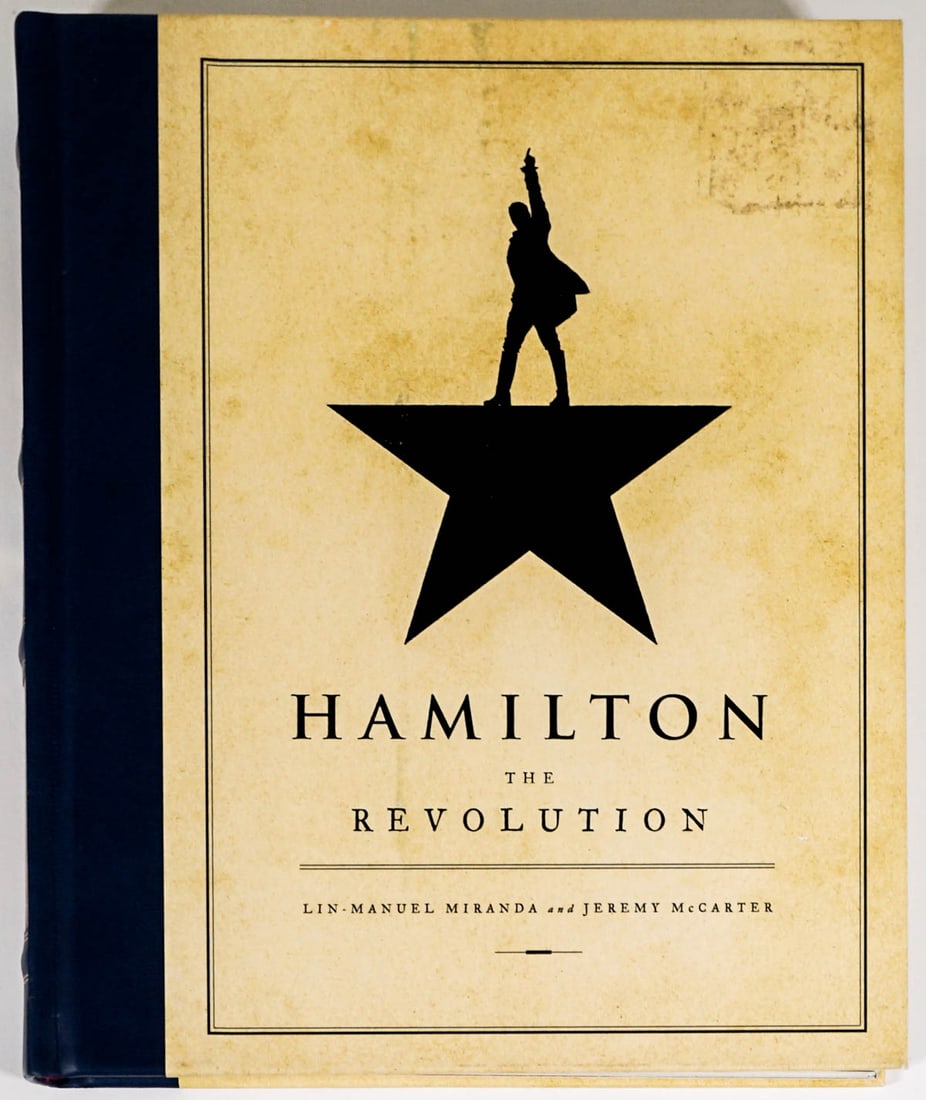 Hamilton The Revolution [Broadway Musical]: Hamilton The Revolution being the complete libretto of the Broadway musical book. 287 pp. Measures 10.5 in. x 9 in. x 1.5 in. Staining and scuffing to covers. If lot is absent of a condition report on