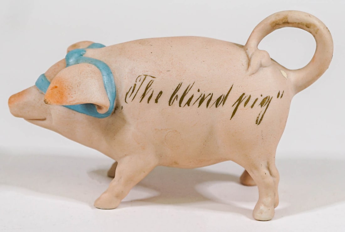Antique The Blind Pig Figural Flask: Antique The Blind Pig Figural Flask. Measures 3.125 x 5 inches length. There is one small chip on the left ear. If lot is absent of a condition report one may be requested via email. Condition report