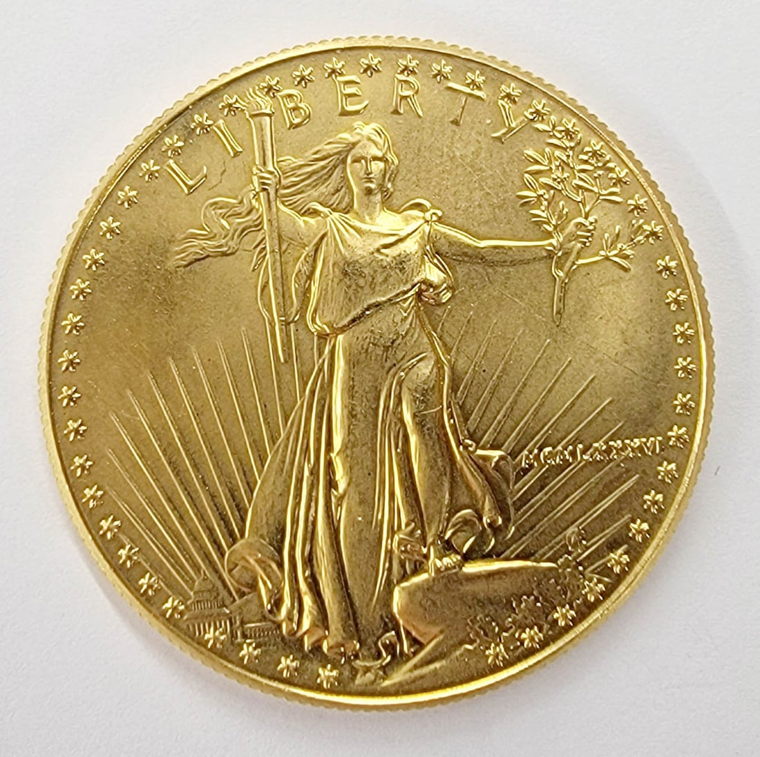 U.S. $50 1 OZ. Fine Gold Bullion Coin: U.S. $50 1 OZ. Fine Gold Bullion Coin. This coin measures 32mm and weighs 34.09 grams. This lot requires a Wire or Zelle transfer. If lot is absent of a condition report one may be requested via email