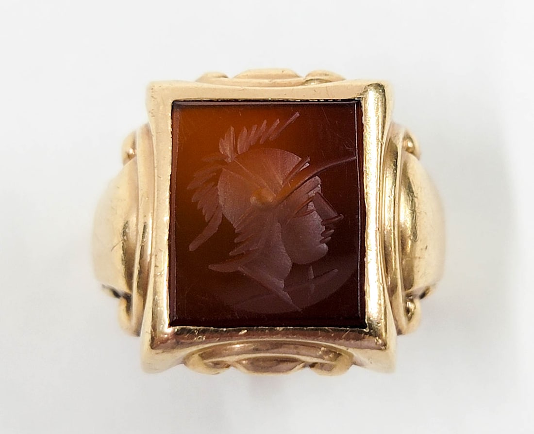 Art Deco 10k YG Intaglio Cut Trojan Ring: Art Deco 10k YG Intaglio Cut Trojan Ring. Head of ring measures .75 x .625 inches. Ring size 9.5, weighs 7.49 grams. If lot is absent of a condition report one may be requested via email. Condition re