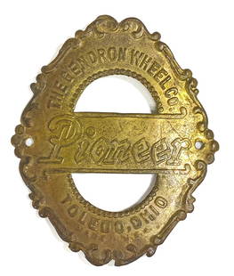 The Gendron Pioneer Bicycle Head Badge: The Gendron Wheel Company (1896-1918, Toledo, Ohio) Pioneer Bicycle Head Badge. Measures 2.5 x 2.25 inches. VG-EX/EX. If lot is absent of a condition report one may be requested via email. Condition