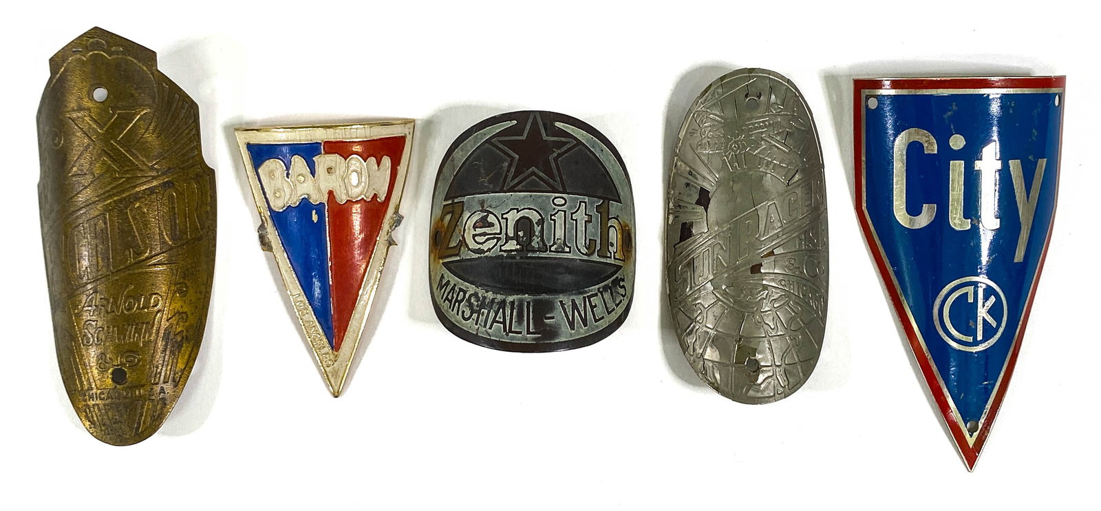 Five Vintage Bicycle Head Badges: Five Vintage Bicycle Head Badges. They measure 2.25 to 3.25 inches height. Mixed condition. If lot is absent of a condition report one may be requested via email. Condition report is provided as an op