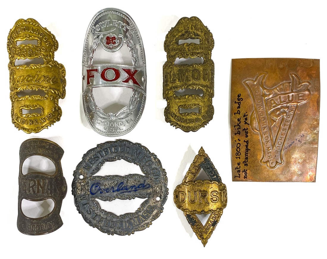 Seven Vintage Bicycle Head Badges: Seven Vintage Bicycle Head Badges. They measure 3 to 3.625 inches height. Mixed condition. If lot is absent of a condition report one may be requested via email. Condition report is provided as an opi