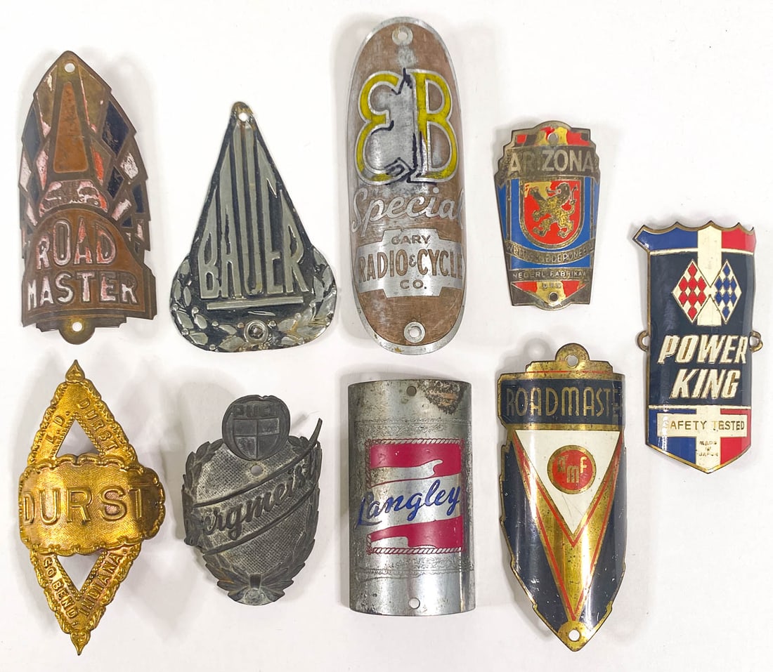 (9) Vintage Bicycle Head Badges: (9) Vintage Bicycle Head Badges. They measure 2 to 3.625 inches height. Mixed condition. If lot is absent of a condition report one may be requested via email. Condition report is provided as an opini
