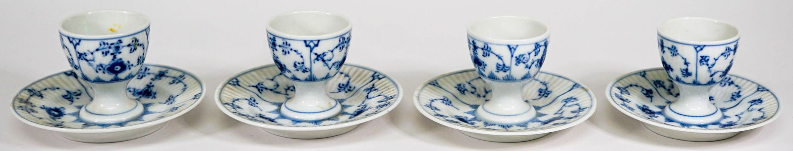 (4) Royal Copenhagen Blue Attached Egg Cups: (4) Royal Copenhagen Blue Attached Egg Cups. They measure 2.5 x 4.25 inches. No damage. If lot is absent of a condition report one may be requested via email. Condition report is provided as an opinio