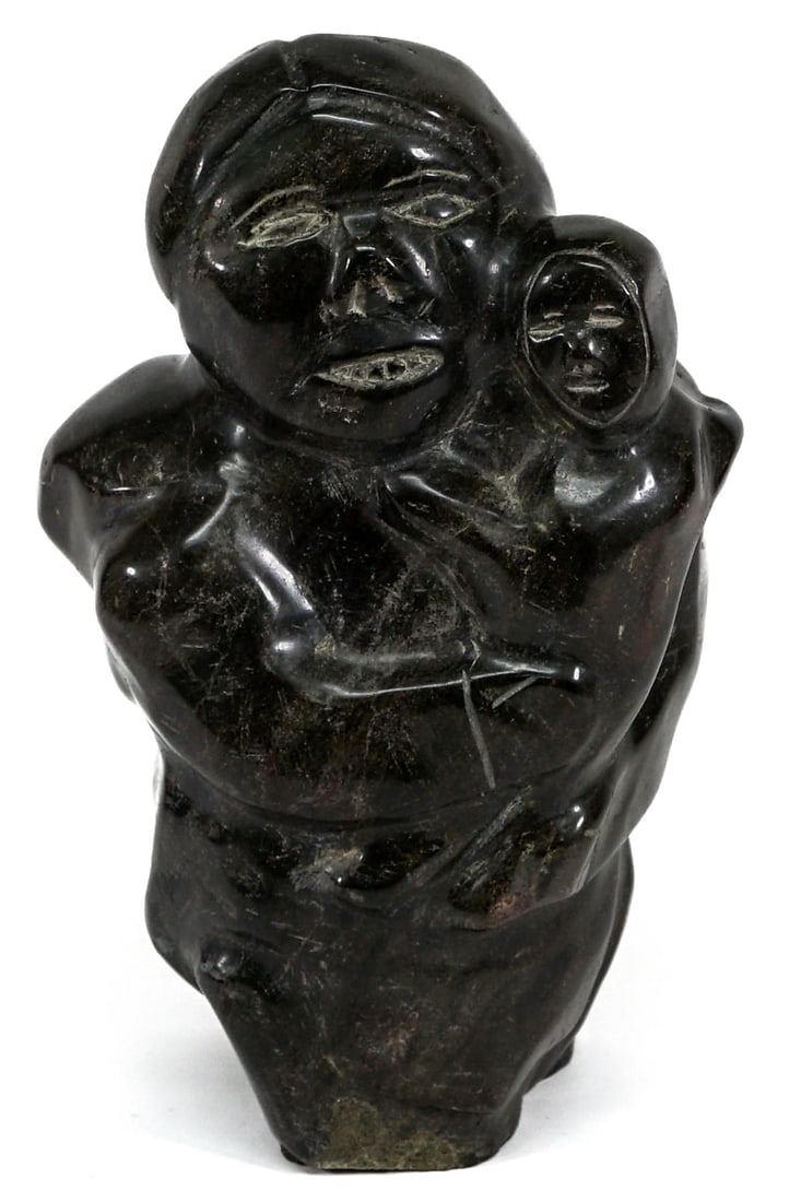 Angalakti Mary Pitseolik Inuit Soapstone: Angalakti Mary Pitseolik Inuit Soapstone. Measures 12 x 5 x 6.5 inches. No damage. If lot is absent of a condition report one may be requested via email. Condition report is provided as an opinion onl