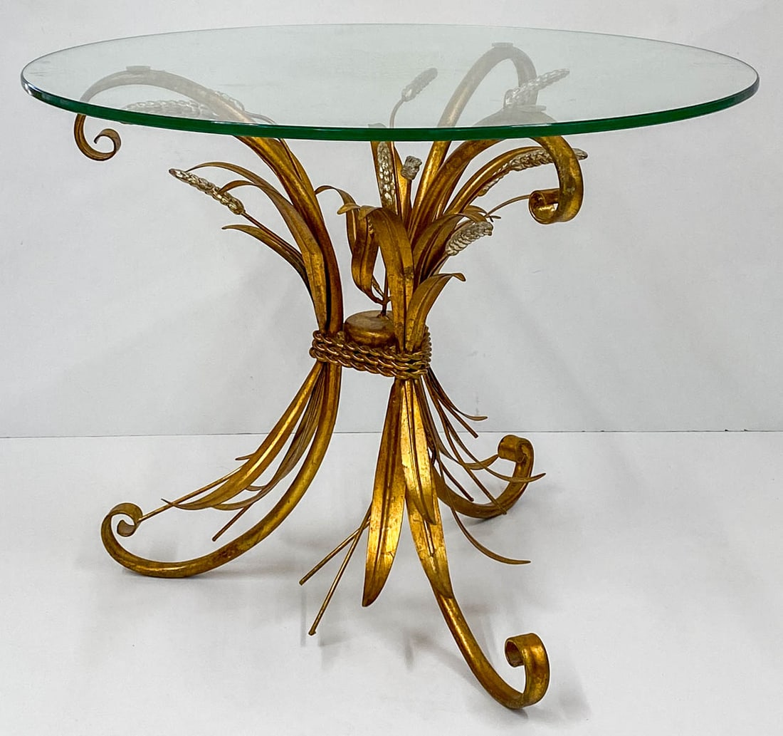 [Cattails] Mid-Century Glass Top Table: [Cattails] Mid-Century Glass Top Table. Measures 26.5 x 20.5 inches. The base is all metal. Excellent condition. No damage or repairs. If lot is absent of a condition report one may be requested via e