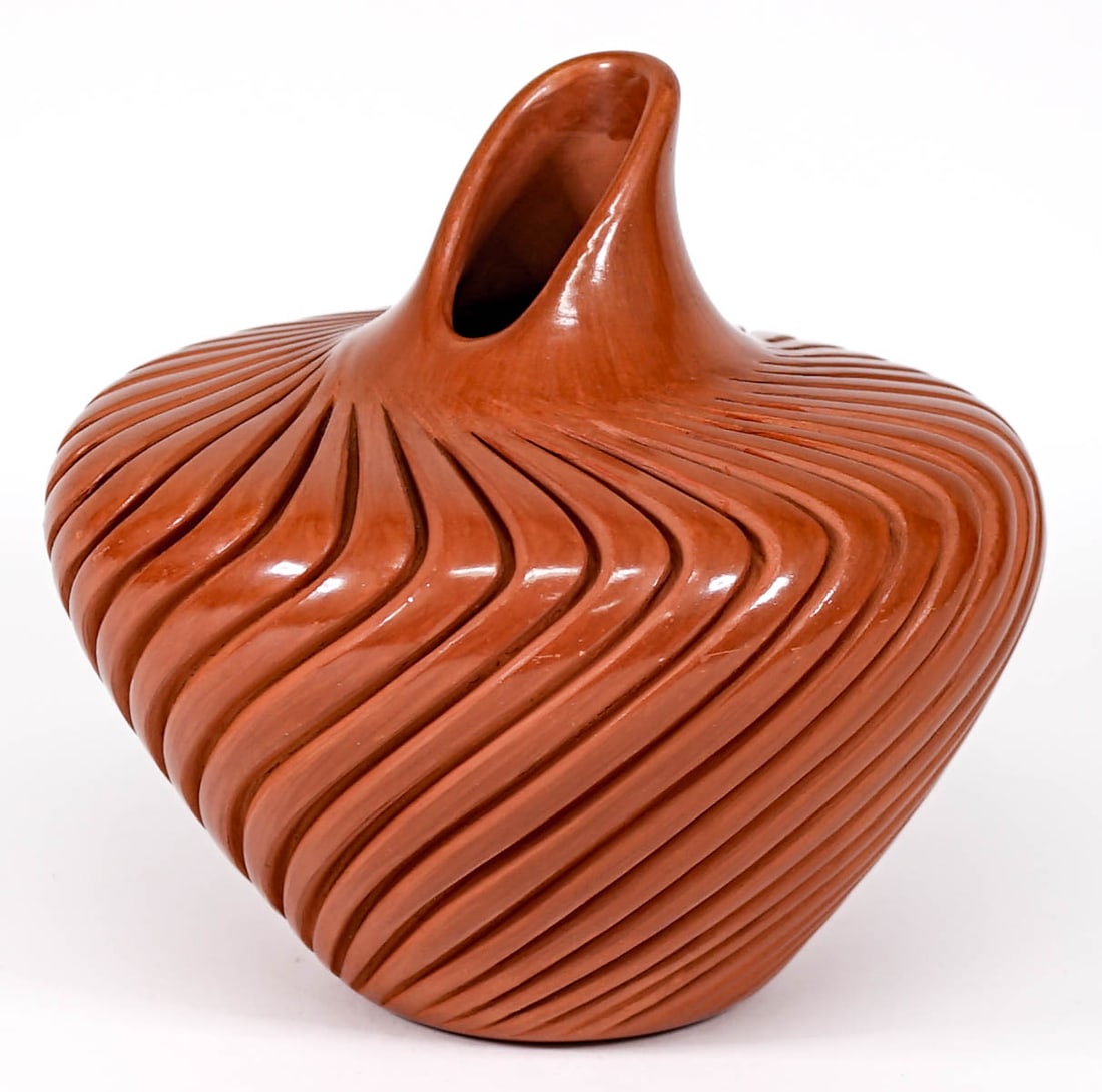 Alvina Yepa Jemez Pueblo Stone Polished 7IN Pot: Alvina Yepa signed Native American Jemez Pueblo New Mexico swirl pot measures 7 in. tall x 7.25 in. wide. No evidence of cracks or repairs. If lot is absent of a condition report one may be requested 