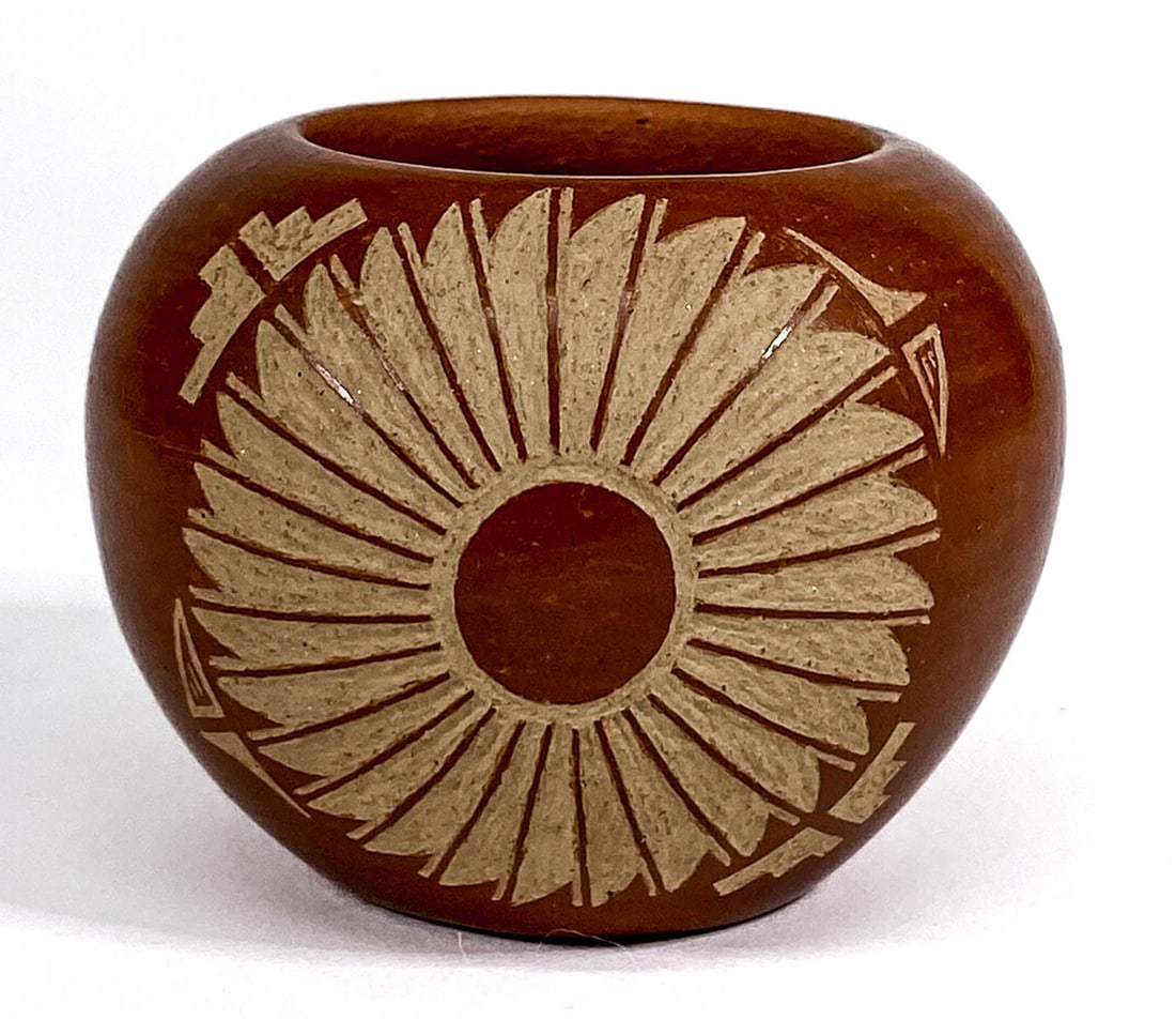 Marie & James Gonzalez San Ildefonso Pot: Marie & James Gonzalez San Ildefonso Pot. Measures 2 x 2.75 inches. No evidence of cracks or repairs. If lot is absent of a condition report one may be requested via email. Condition report is provide