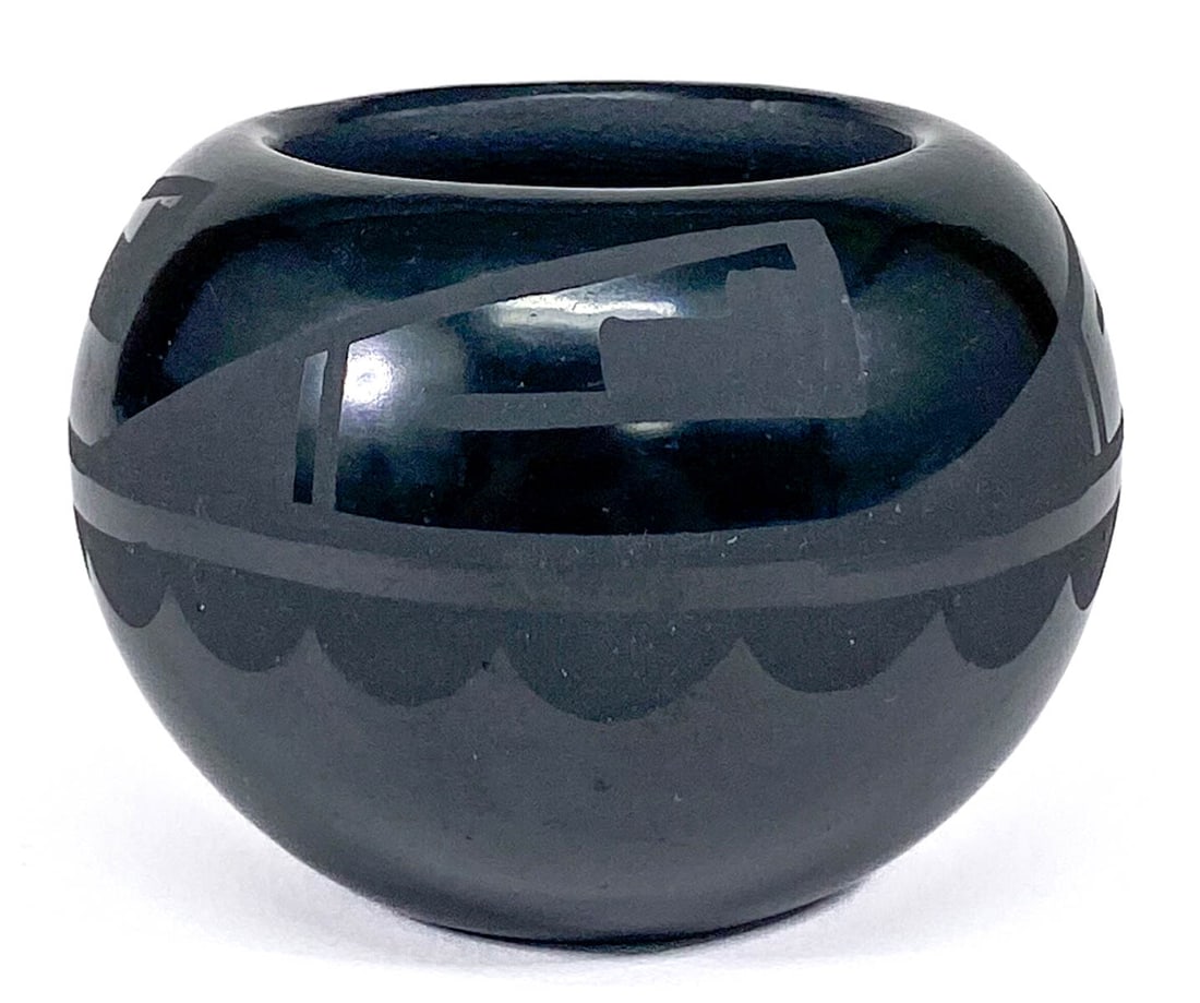 Helen Guitierrez Small San Ildefonso Pot: Helen Guitierrez Small San Ildefonso Pot. Measures 2 x 3 inches. No evidence of cracks or repairs. If lot is absent of a condition report one may be requested via email. Condition report is provided a