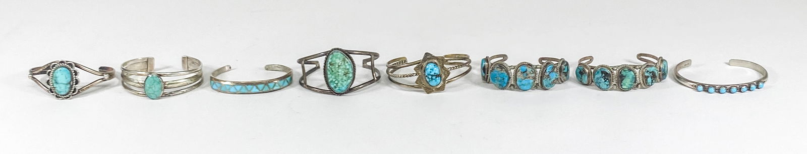 Group of Eight Assorted Navajo Cuff Bracelets: Group of Eight Assorted Navajo Cuff Bracelets. No evidence of damage or repairs. If lot is absent of a condition report one may be requested via email. Condition report is provided as an opinion only