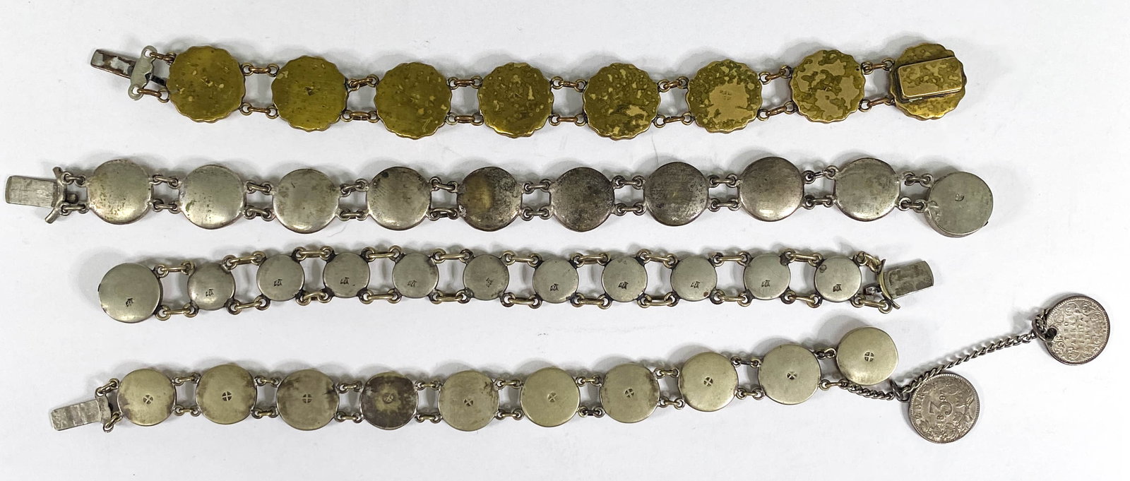 Satsuma Bracelets (4): Four antique Satsuma bracelets. They measure .5 inches width x 7 inches length to .75 inches width and up to 8 inches length. No signs of damage or repairs. If lot is absent of a condition report one 