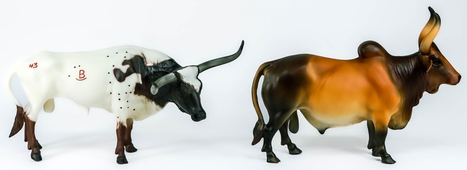 Breyer (2) Creations 384 Longhorn 385 Bull MIB: Two (2) Breyer Creations include: 384 Texas Longhorn and 385 Red Brahma Bull figures with original box. Lot measures 14.5 in. x 10 in. x 16 in. If lot is absent of a condition report one may be reques