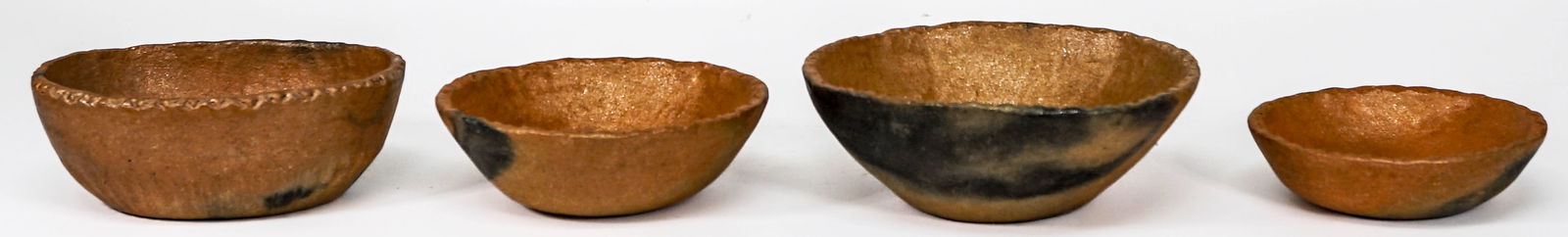 Four Pieces Picuris Micaceous Taos Bowls: Four Pieces Picuris Micaceous Taos Small Bowls. They measure 5.25-7.25 inches diameter. Excellent condition. No chips, cracks or repairs. Provenance: Estate collection Missoula, Montana. If lot is abs