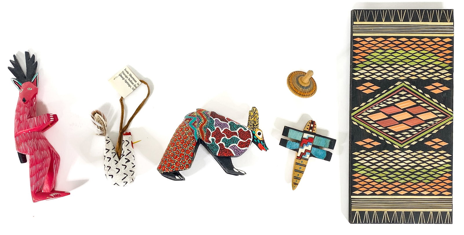 (6) Painted Wood Carvings [Chicken, Deer]: Six (6) carved wood painted items include: 9.5 in. x 4.5 in. painted rug plaque; chicken ornament; armadillo; airplane, spinning top and deer. If lot is absent of a condition report one may be request