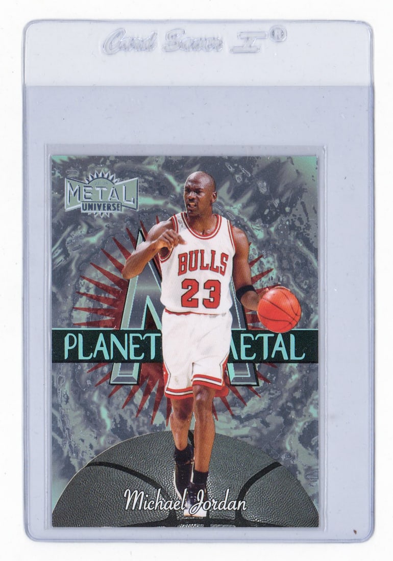 1997-98 Planet Metal #1 Michael Jordan: 1997-98 Metal Universe Planet Metal #1 Michael Jordan. EX-MT or better with edge chipping evident on verso. Condition of card, or cards, is given as an opinion only and not a guarantee for grades if s