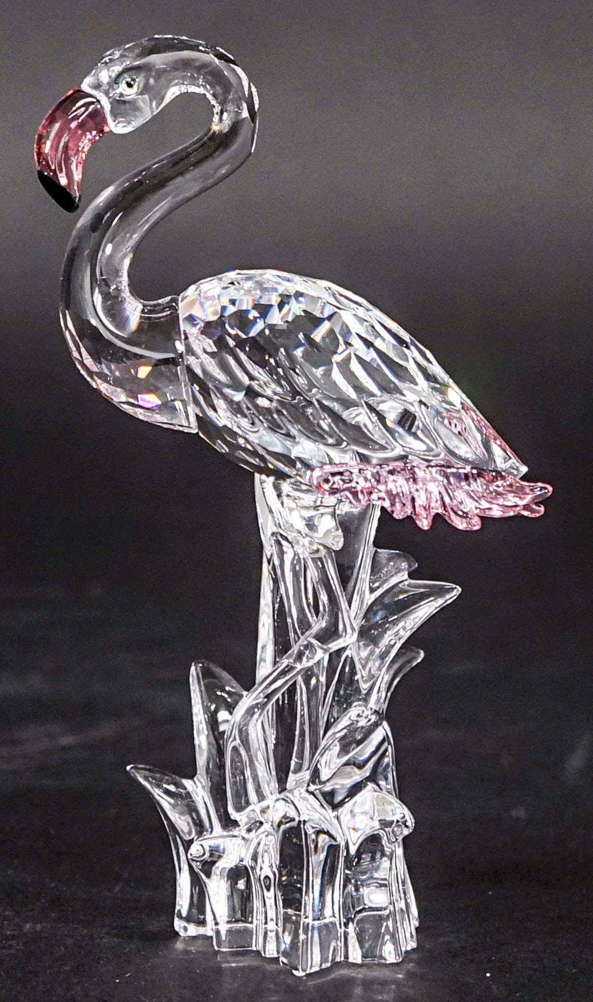 Swarovski Crystal 6 IN Pink Flamingo MIB: Swarovski crystal flamingo Made in Austria measures 6 in. tall. No evident cracks or repair. If lot is absent of a condition report one may be requested via email. Condition report is provided as an o