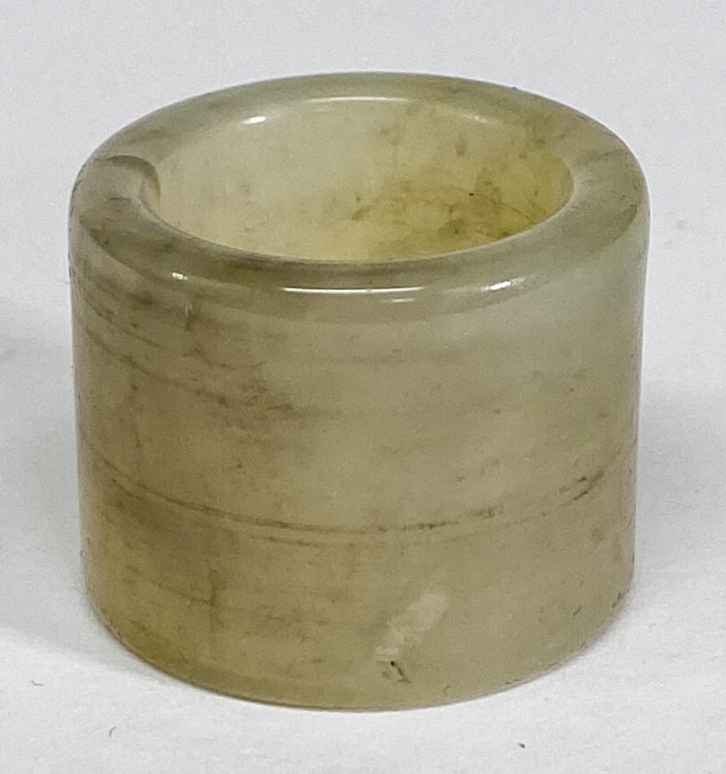 Chinese Jade Archers Ring: Chinese Jade Archers Ring. Measures 1 x 1.125 inches (25 x 30 mm), weighs 21 grams. Ring size 10. No damage. Provenance: Spokane, Washington estate collection. If lot is absent of a condition report o
