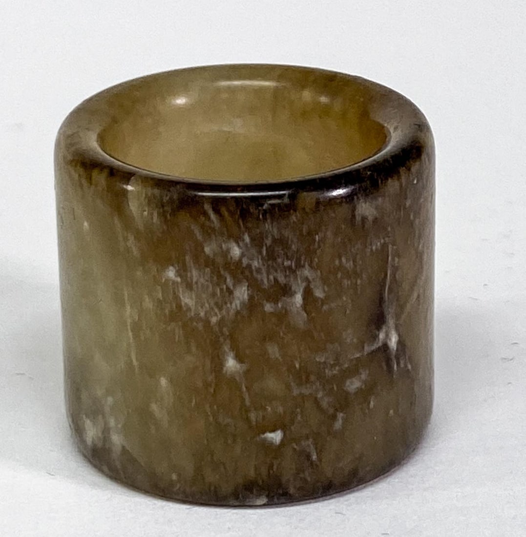 Chinese Jade Archers Ring: Chinese Jade Archers Ring. Measures 1 x 1.125 inches (25 x 30 mm), weighs 22 grams. Ring size 10. No damage. Provenance: Spokane, Washington estate collection. If lot is absent of a condition report o