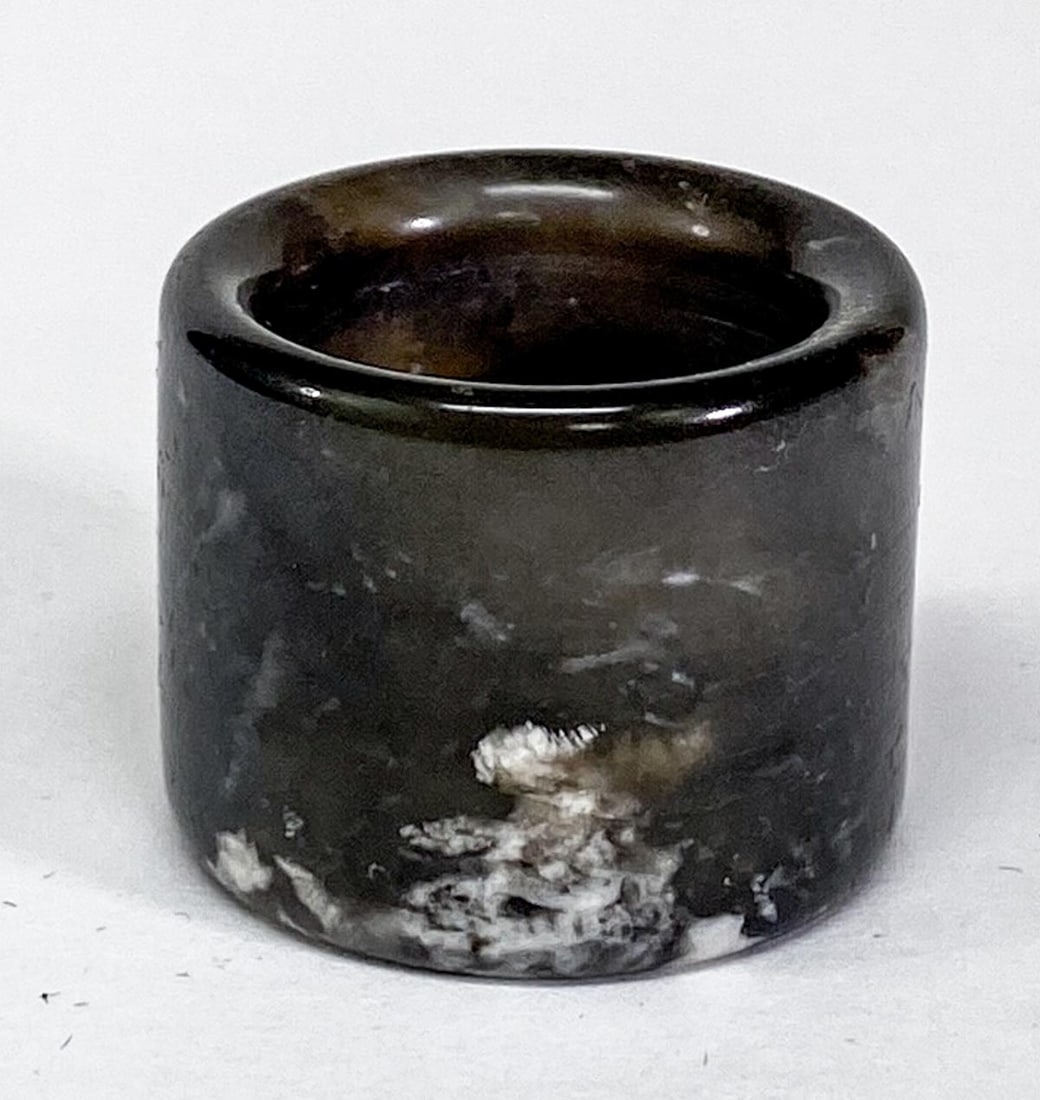 Chinese Jade Archers Ring: Chinese Jade Archers Ring. Measures .875 x 1.125 inches (23 x 28 mm), weighs 19 grams. Ring size 10. No damage. Provenance: Spokane, Washington estate collection. If lot is absent of a condition repor