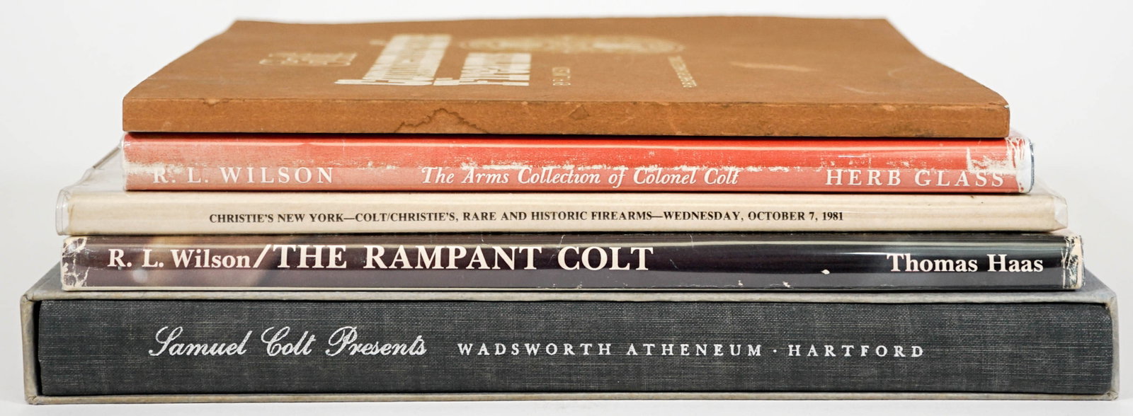 R. L. Wilson (5) Colt Firearm Books SIGNED: Five (5) Colt Firearms books all inscribed and signed. Includes: 1) Samuel Colt Presents with slipcover. 2) The Arms Collection of Colt with unclipped dust jacket. 3) Colt Commemorative Firearms. Soft