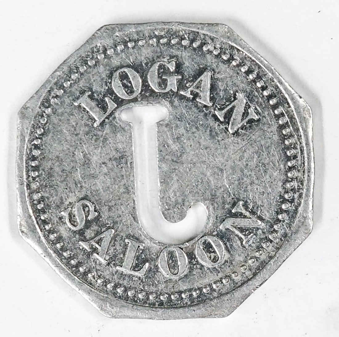 Logan Saloon Unlisted Trade Token Logan, Montana: Logan Saloon Unlisted Trade Token Logan, Montana. Octagonal aluminum token. Good For One Drink. VG-EX/EX. condition. Measures 25 mm. If lot is absent of a condition report one may be requested via ema