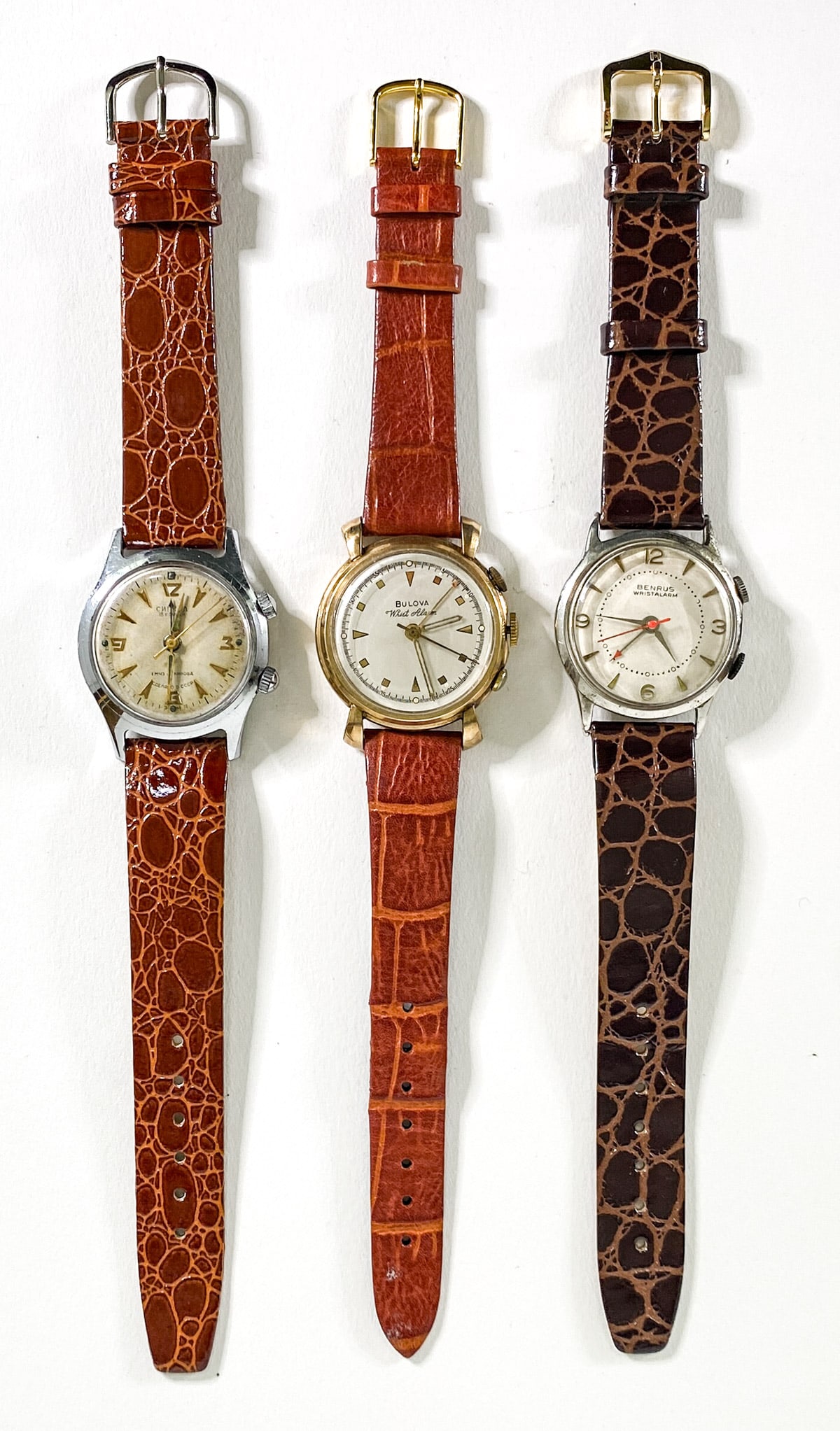 Three Vintage Wrist Watches: 1. Benrus Wrist Alarm 28 mm 2. USSR 27 mm. 3. Bulova 10k Gold Filled Wrist Alarm 28 mm. None are in running order. If lot is absent of a condition report one may be requested via email. Condition repo