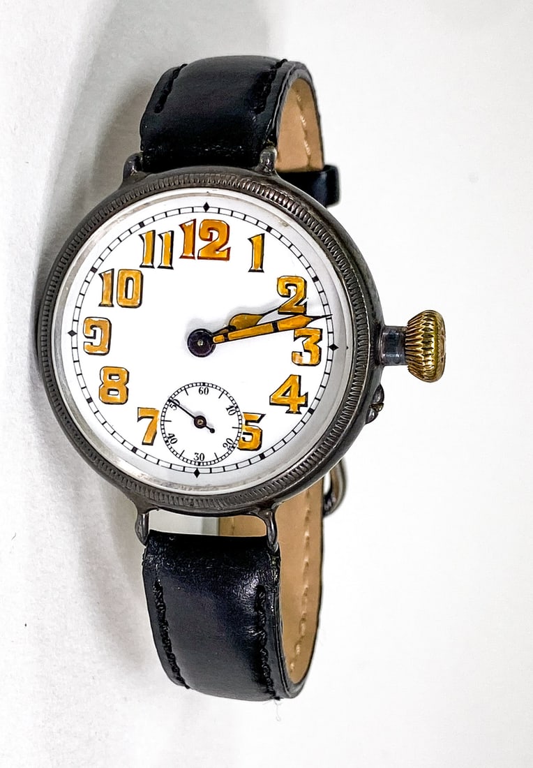 A Rare Helvetia Wrist Watch-Case by Baumgartner: A Rare Helvetia Trench Watch with .935 silver case by Frances Baumgartner. Dial measures 29 mm, total diameter 34 mm. Not in running order. If lot is absent of a condition report one may be requested