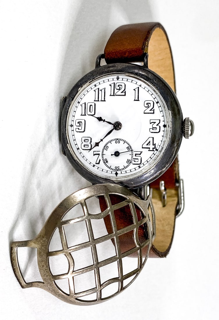 WWI Sterling Silver Officer's Watch Trench Guard: WWI Sterling Silver Officer's Watch with Trench Guard, 17 Jewels. Dial measures 28 mm, total diameter 33 mm. Running condition, not tested for accuracy. If lot is absent of a condition report one may 