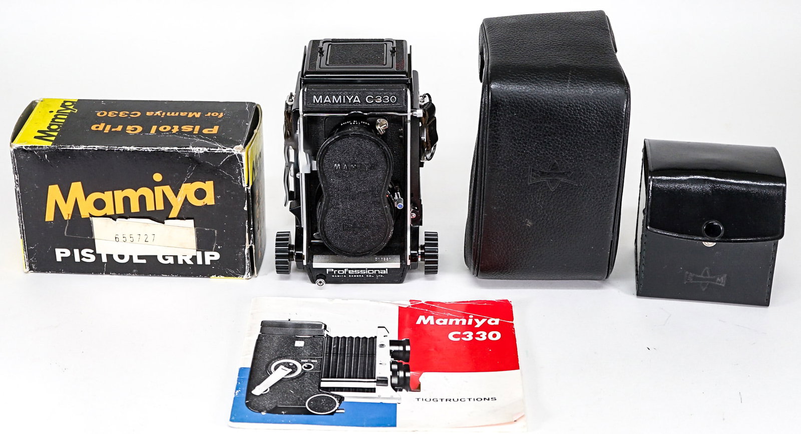 Mamiya -Sekor C330 Camera w/ 80mm Lenses: Mamiya-Sekor C330 Professional camera with 1:2.8 / f=80mm lenses. S/N 798720 and 797408. Includes Pistol Grip, Magnifying Hood, cover case and instruction booklet. Items not tested and are in as-is co
