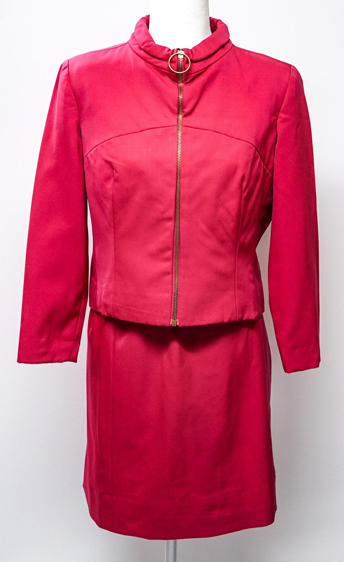 Braniff Airways - Emilio Pucci 1966 Hostess Suit: Braniff International Airways (circa 1966) hostess 2pc (Hot Pink / Raspberry) uniform. Jacket features a brass ring zipper and measures 19 in. across chest measured at underarm x 20.5 in. long measure